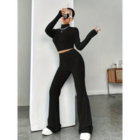 Black knit two-piece outfit.