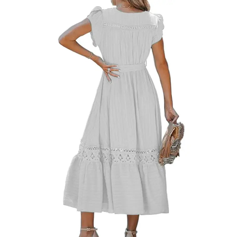 White midi dress with lace trim.