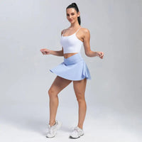 Woman in white top and blue skirt.