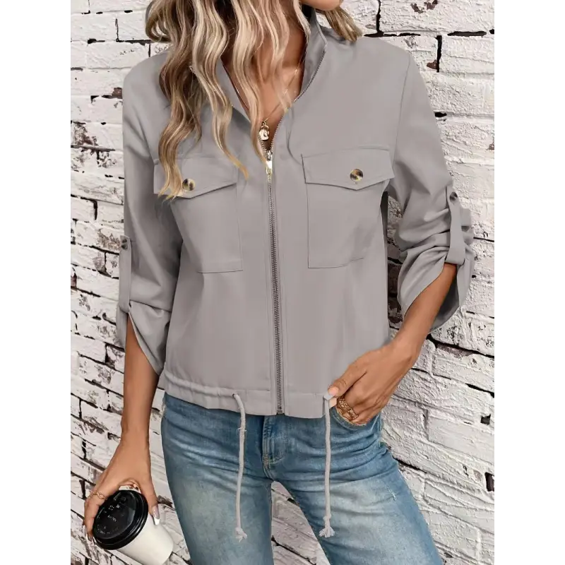 Gray zip-up jacket with pockets.