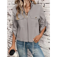 Gray zip-up jacket with pockets.