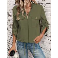 Olive green zip-up jacket.