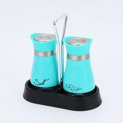 Stainless steel salt and pepper shakers with chrome accents in a black holder