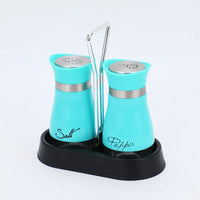 Stainless steel salt and pepper shakers with chrome accents in a black holder