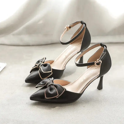 Black high-heeled shoes with bow.