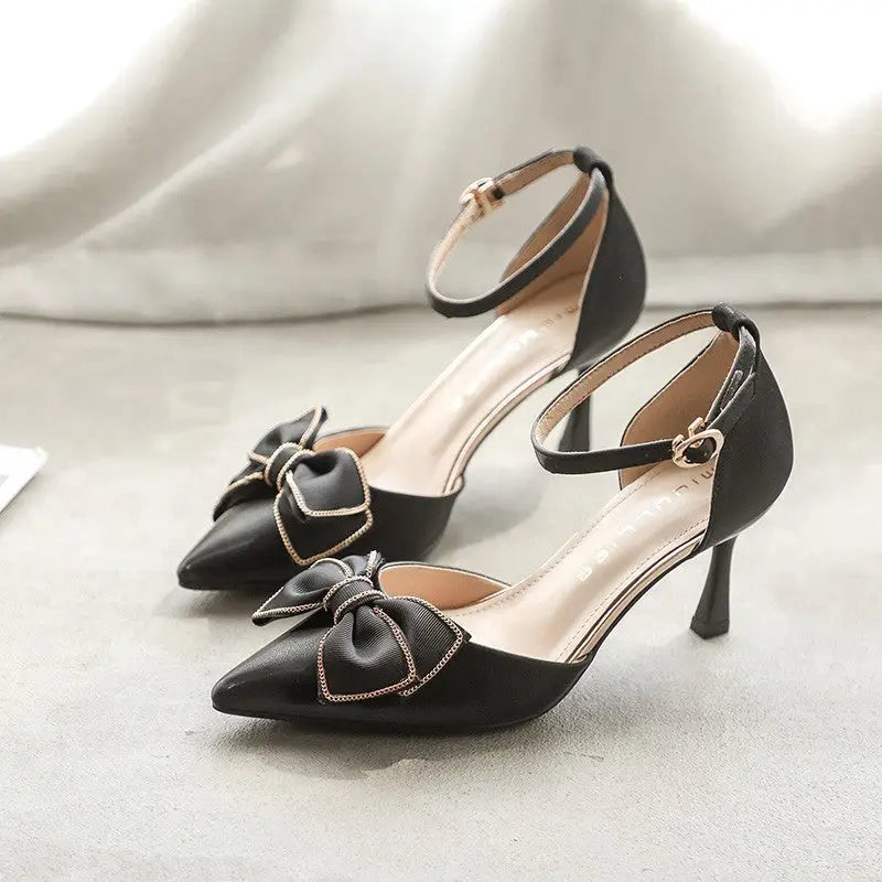 Black high-heeled shoes with bow.