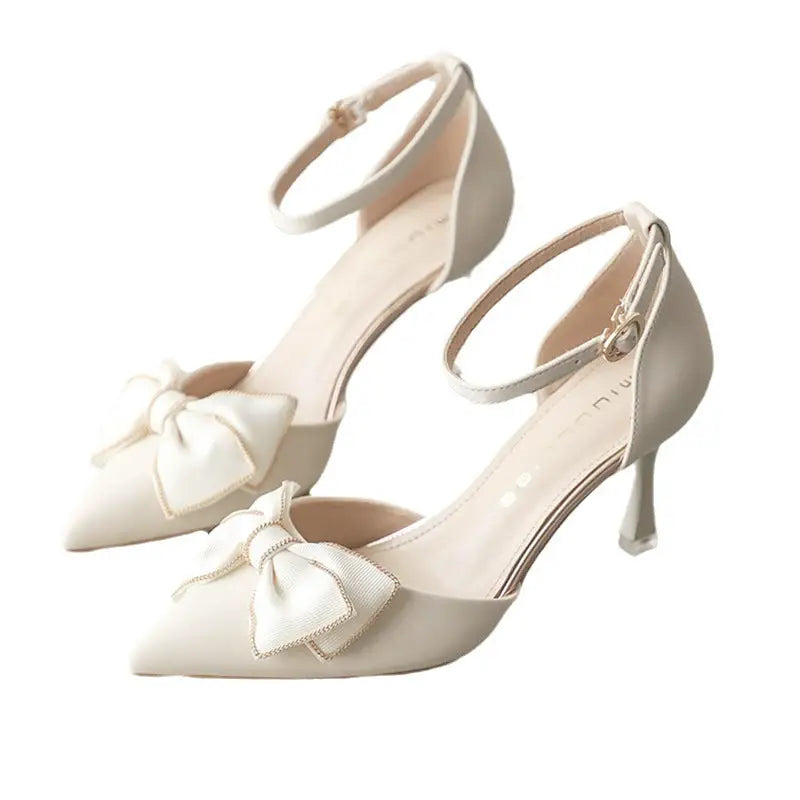Elegant ankle-strap heels with bow.
