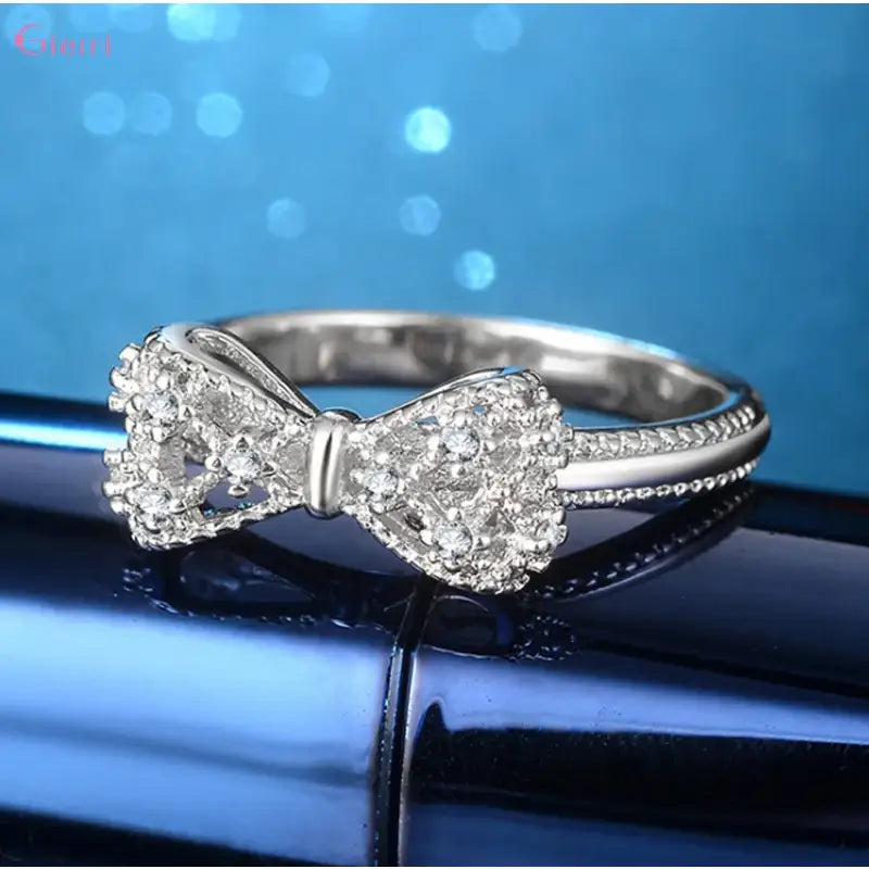 Silver bow ring.