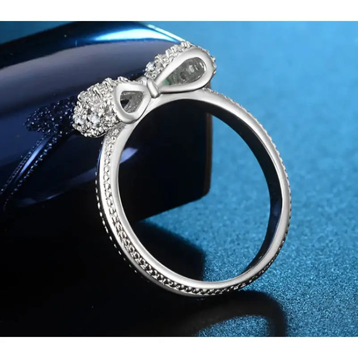 Silver ring with a bow.