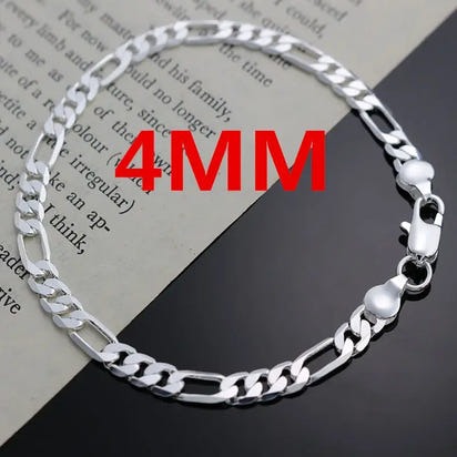 Silver Figaro chain bracelet.