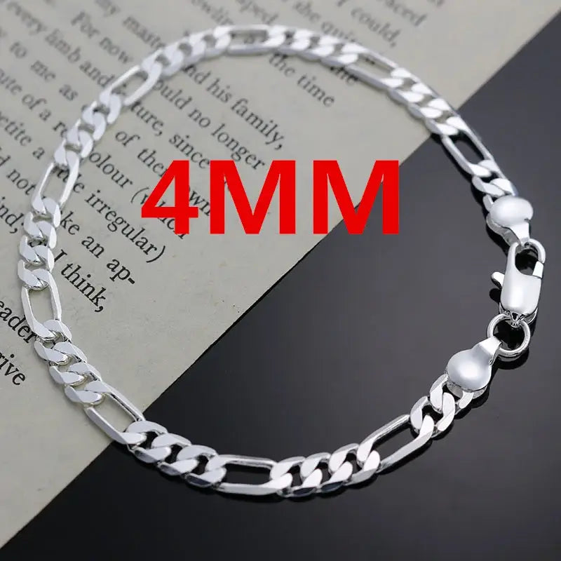 Silver Figaro chain bracelet.