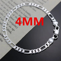 Silver Figaro chain bracelet.