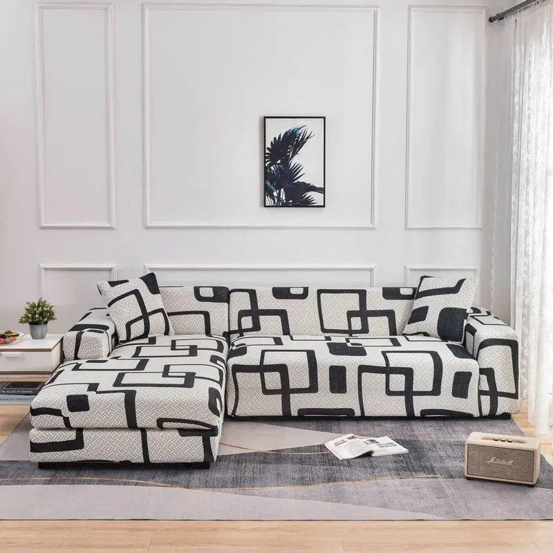 Black and white patterned stretch sofa cover on a sectional sofa for stylish protection