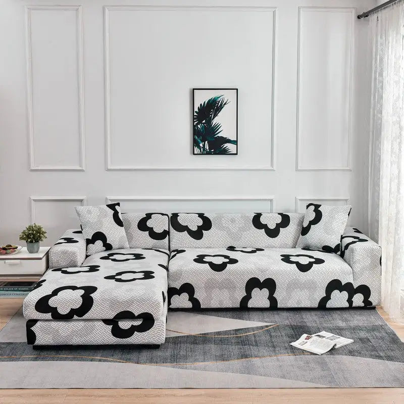 Floral-patterned stretch sofa cover on sectional sofa for stylish protection