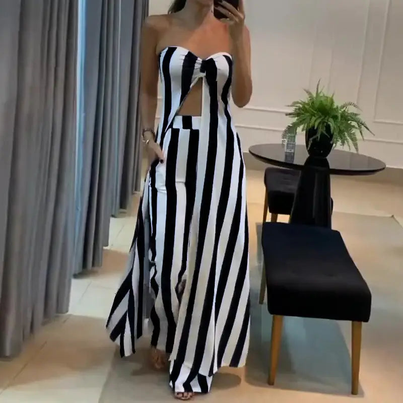 Striped strapless jumpsuit with a front cutout.