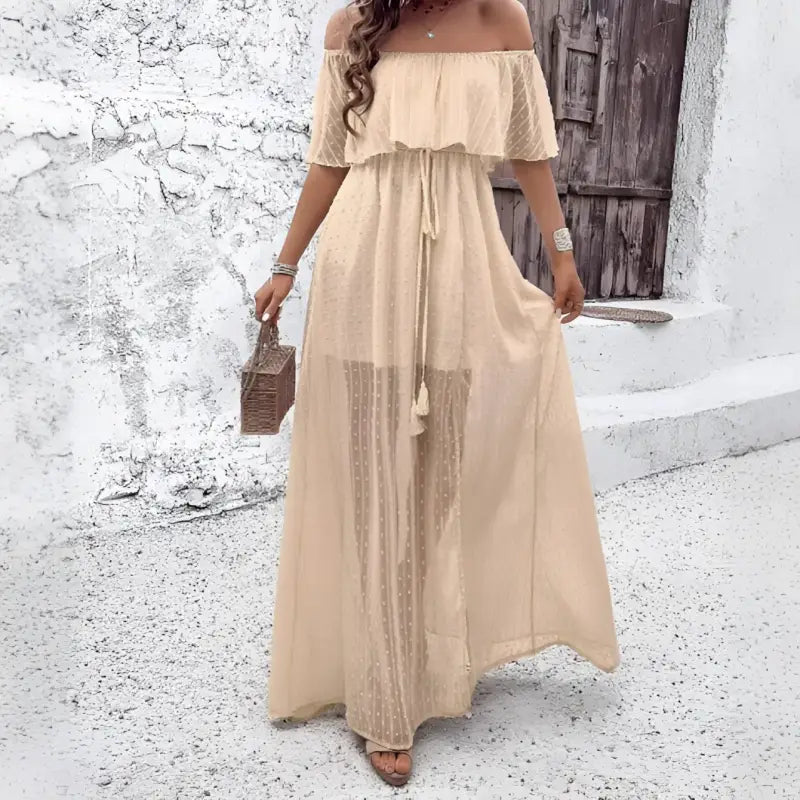 Off-the-shoulder beige maxi dress.