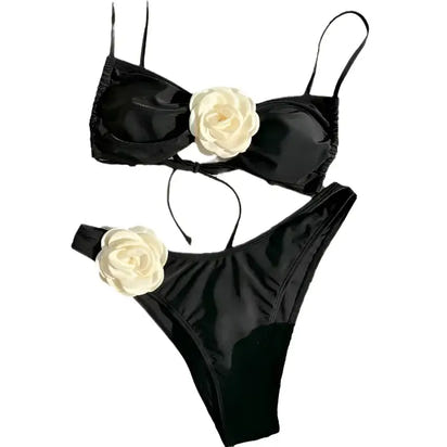 Black two-piece swimsuit with floral accents.