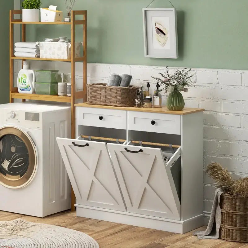 White laundry hamper cabinet with drawers.