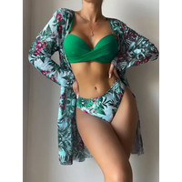 Woman’s green bikini and floral cover-up.