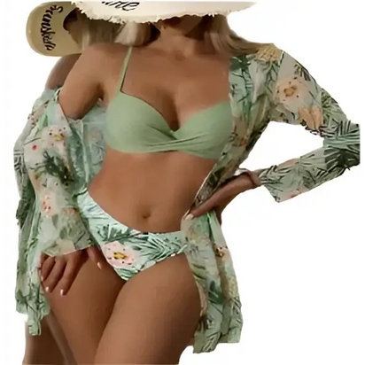 Woman in a green bikini with a floral cover-up and sun hat.