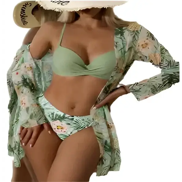 Woman in a green bikini with a floral cover-up and sun hat.