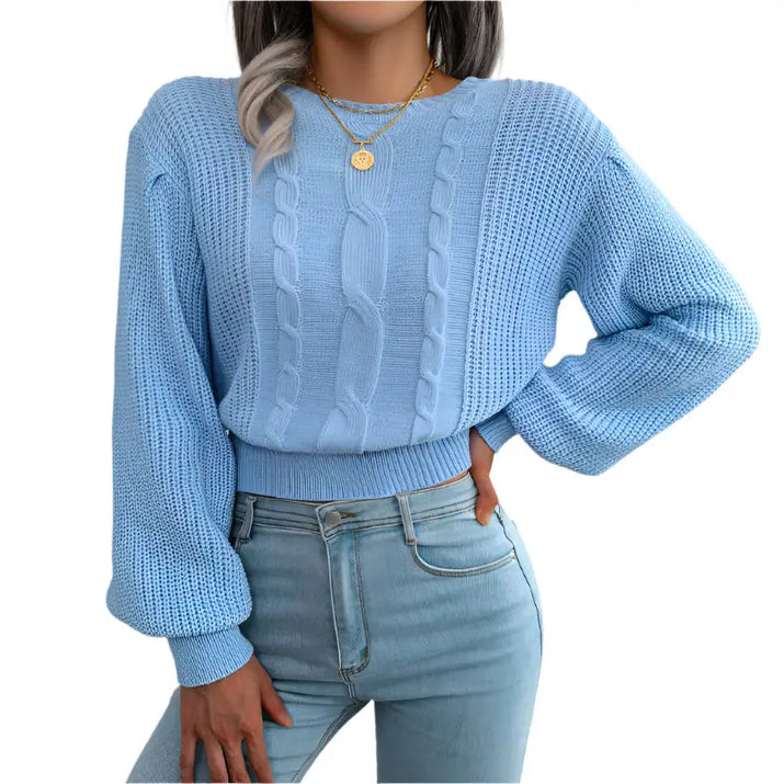 Light blue cable-knit sweater.