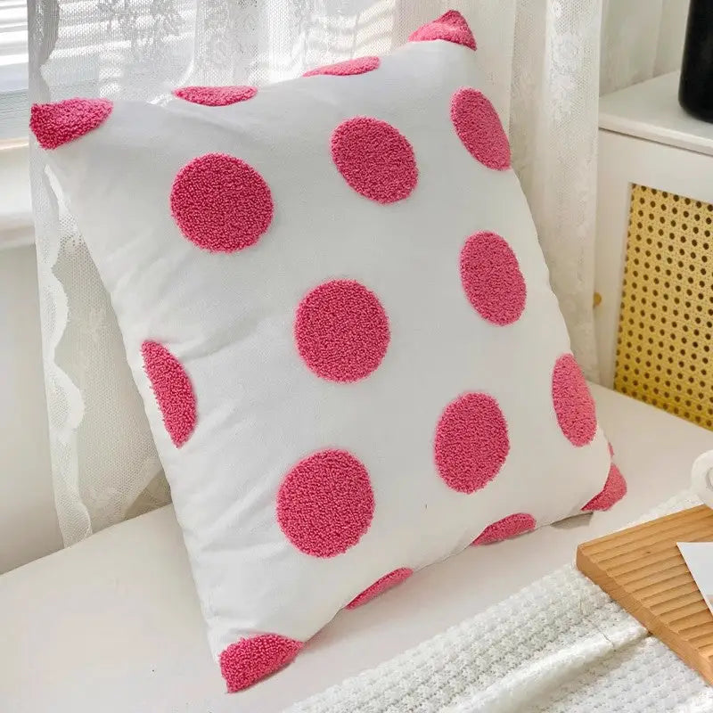 White pillow with pink polka dots from Twisted Strip Sofa Throw Cushion collection
