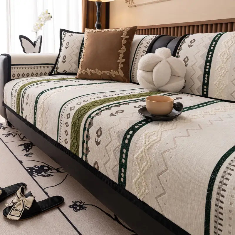 Luxurious cushion cover on patterned sofa with decorative pillows for stylish protection