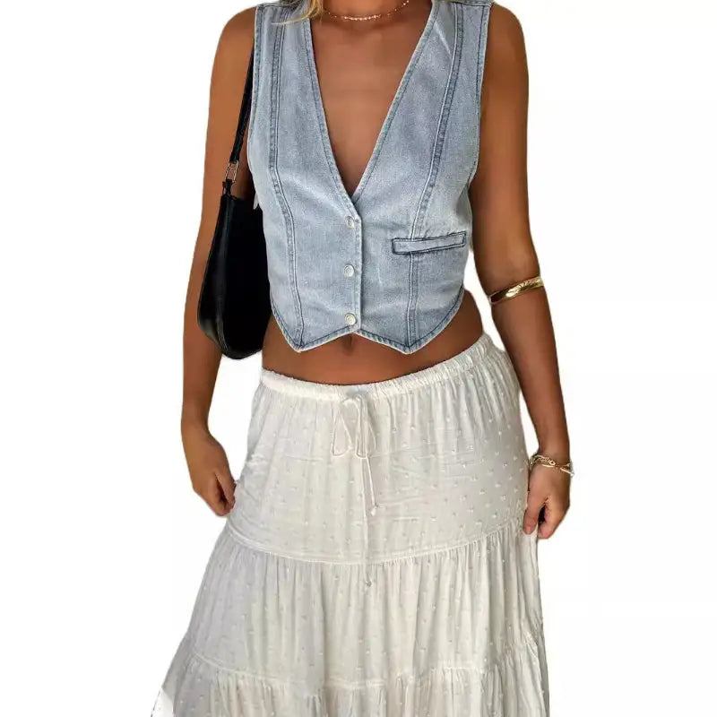 Light blue denim vest.