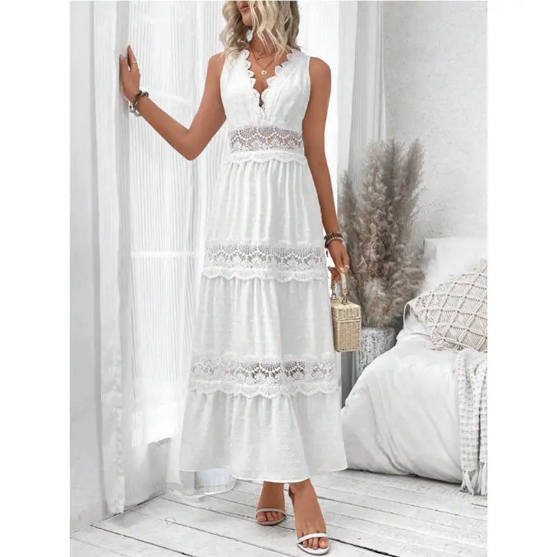 White sleeveless lace-trimmed maxi dress.