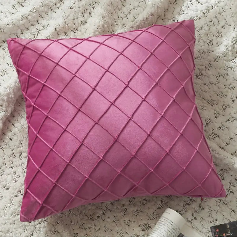 Pink velvet embroidered cozy cushion with diamond-shaped lattice design