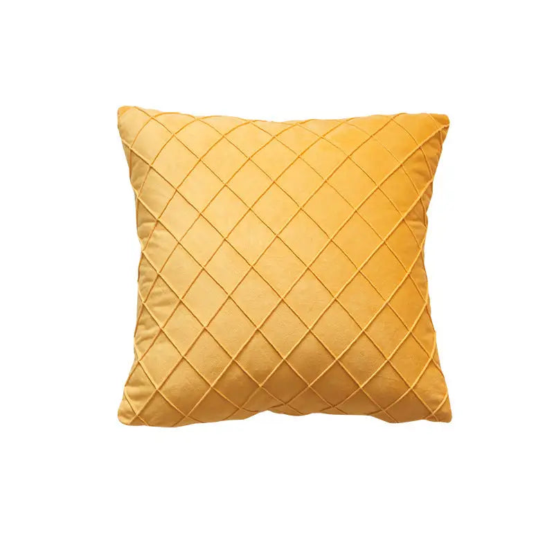 Yellow velvet embroidered cushion with diamond-shaped lattice quilting for a cozy cushion look
