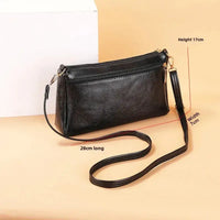 Black leather shoulder bag.