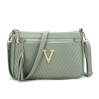 Light green versatile shoulder women’s purse with gold V detail for stylish convenience