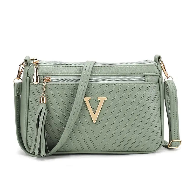 Light green versatile shoulder women’s purse with gold V detail for stylish convenience