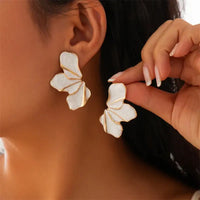 White and gold vintage-inspired half flower stud earrings for elegant accessory style