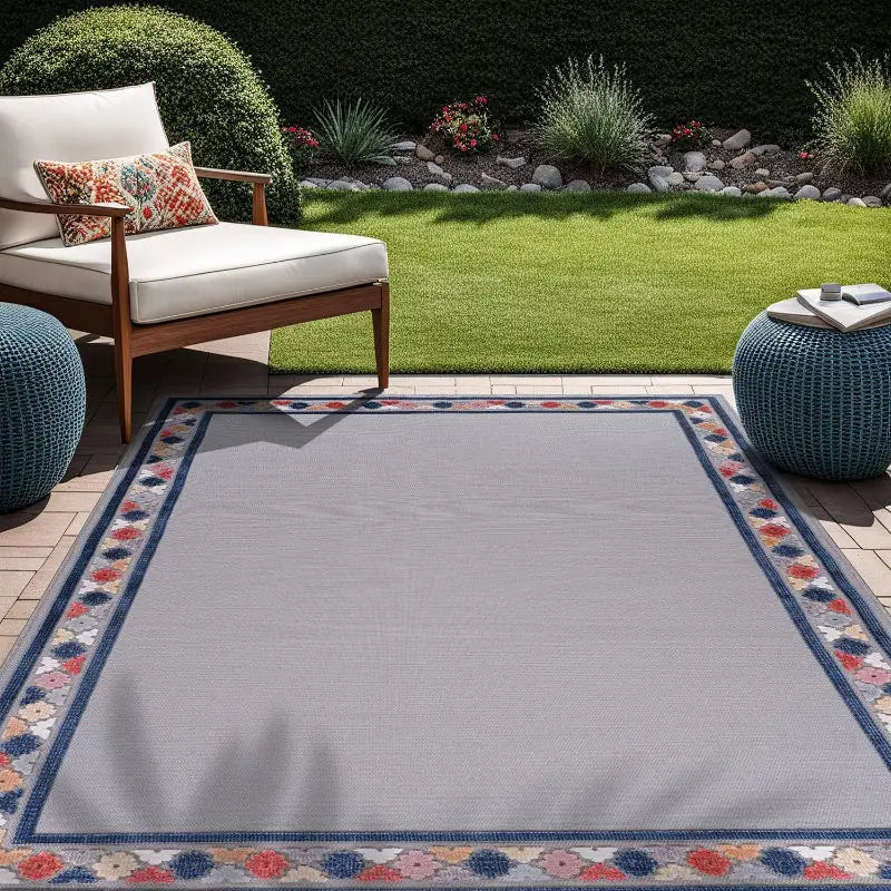 Gray vintage floral outdoor patio mat with patterned border for stylish outdoor decor