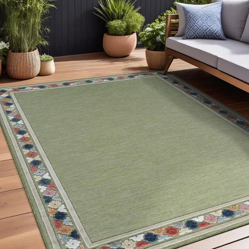 Vintage floral outdoor patio mat with green and floral border for outdoor spaces
