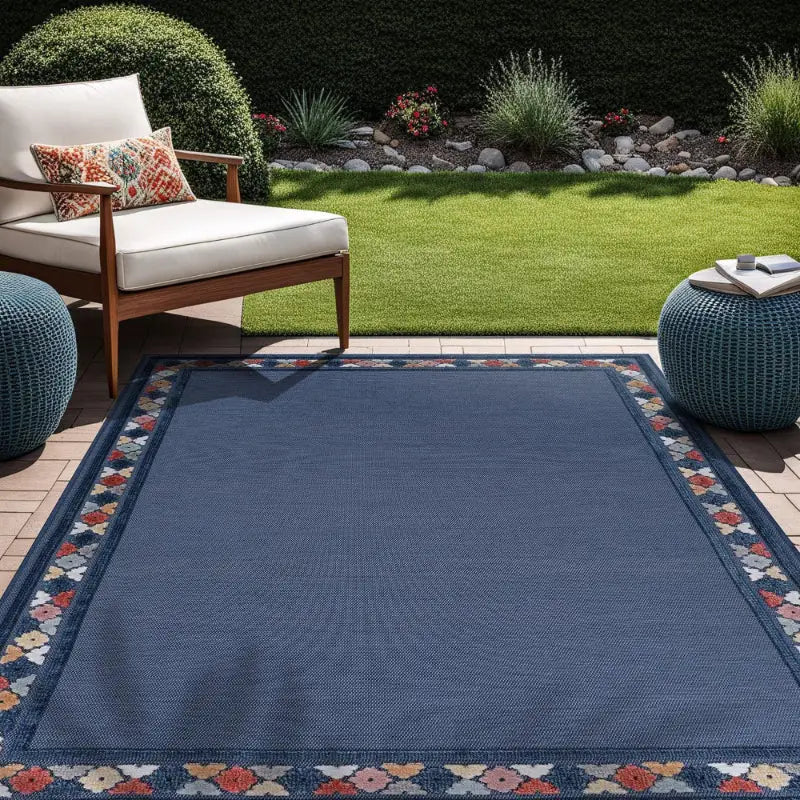 Blue vintage floral outdoor patio mat with patterned border for outdoor decor