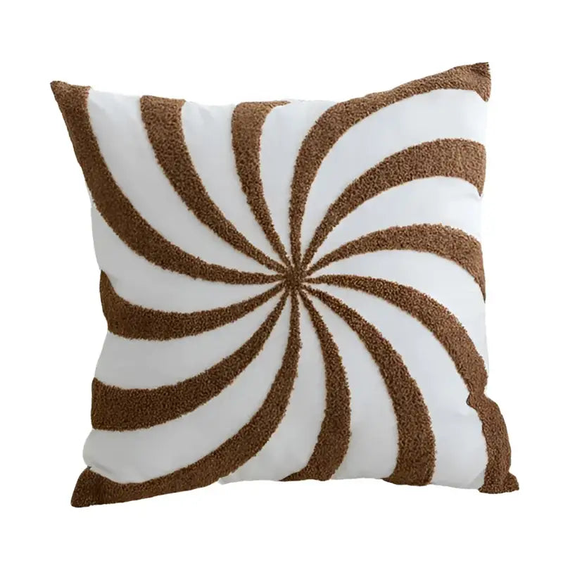 White pillow with brown swirl design on Vintage Knotted Cushion, stylish knotted cushion decor