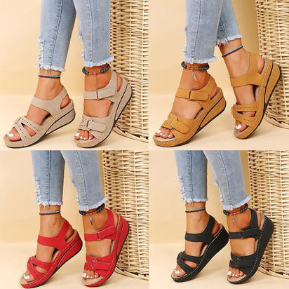 Four pairs of colorful vintage women’s sandals showcasing fun vintage women’s style