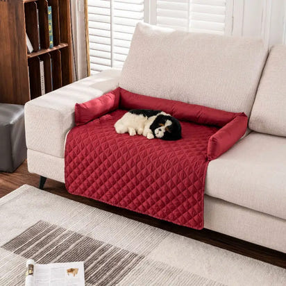 Red quilted sofa protector with bolster arms for waterproof pet mat and dog pet mat protection