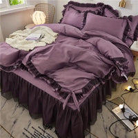 Purple ruffled bedding set.