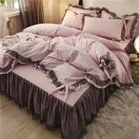 Pink and gray ruffled bedding set.