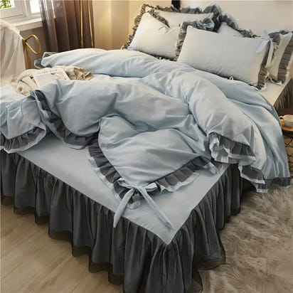 Blue and gray ruffled bedding set.