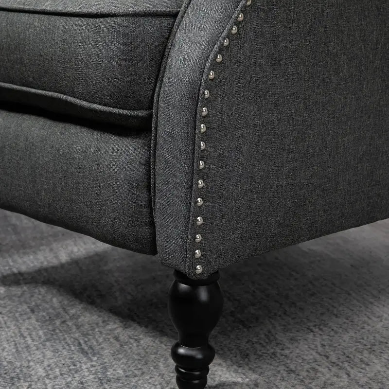 Gray upholstered wingback reclining chair with nailhead trim, stylish reclining chair
