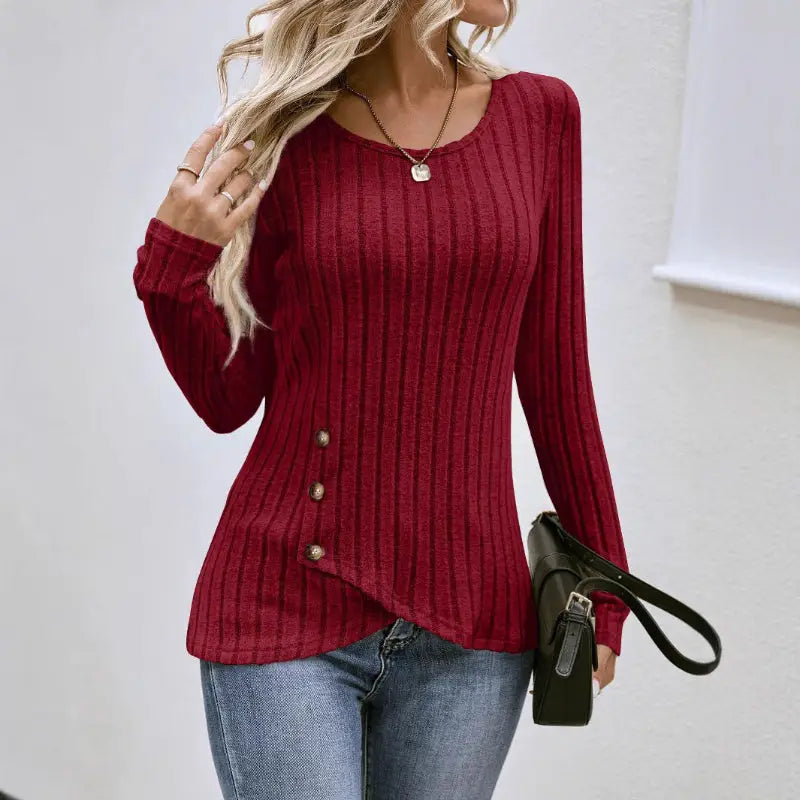 Burgundy ribbed knit top with asymmetrical hem.
