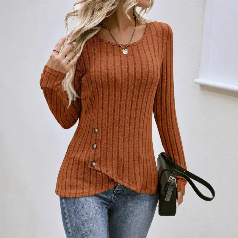 Ribbed knit top with asymmetrical button detail.