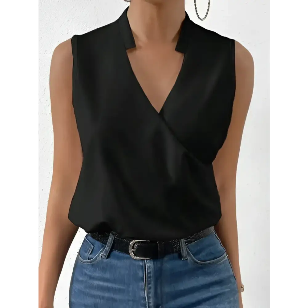Sleeveless black wrap blouse.