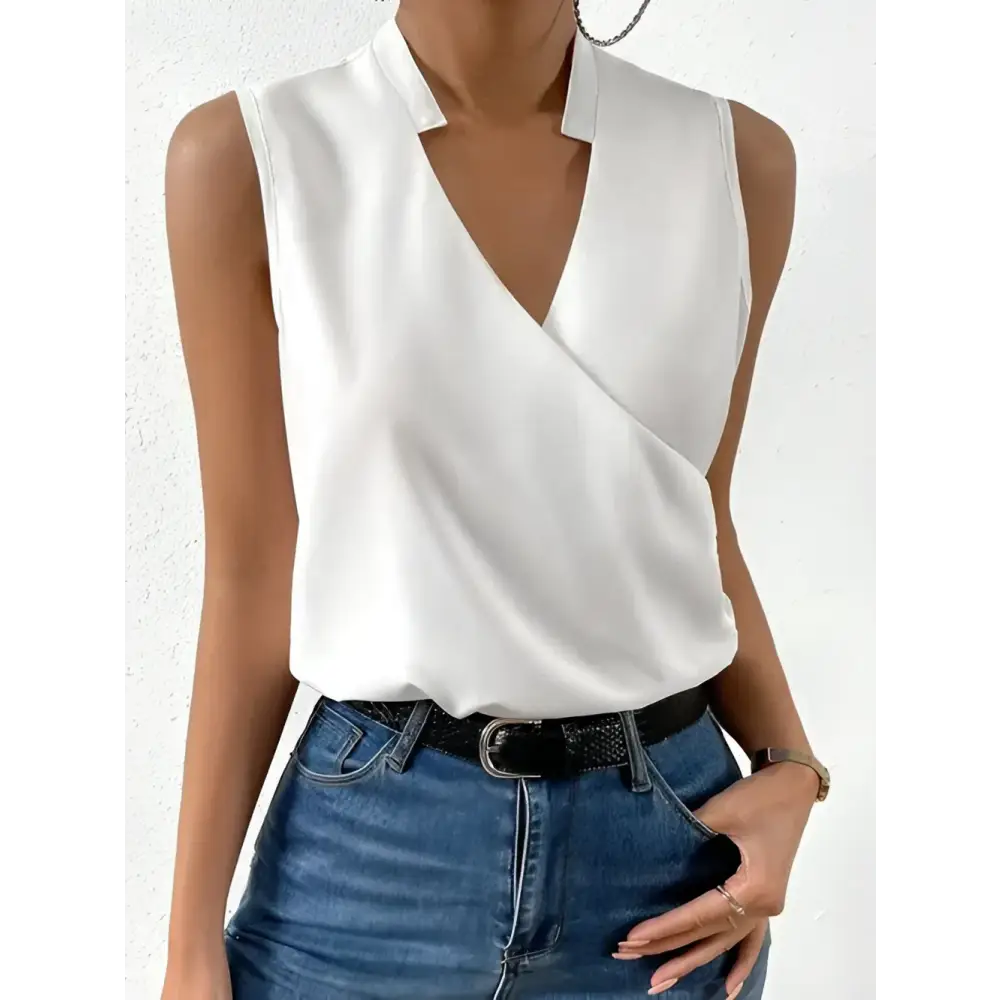 Sleeveless white wrap blouse.